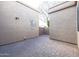 Backyard access with brick pavers and wall art at 4116 E Sunnyside Dr, Phoenix, AZ 85028