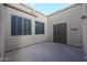 Private courtyard with brick pavers, storage, and window shutters at 4116 E Sunnyside Dr, Phoenix, AZ 85028