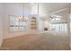 Open concept dining room with a chandelier and built-in shelving at 4116 E Sunnyside Dr, Phoenix, AZ 85028