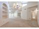 Elegant dining room with a chandelier and built-in shelving at 4116 E Sunnyside Dr, Phoenix, AZ 85028