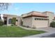 Tan stucco home with tile roof, 2-car garage, and landscaped lawn at 4116 E Sunnyside Dr, Phoenix, AZ 85028