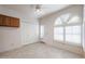 Bright kitchen with wood cabinets and tiled floor at 4116 E Sunnyside Dr, Phoenix, AZ 85028