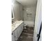 Updated bathroom with marble vanity and new fixtures at 4220 W State Ave, Phoenix, AZ 85051