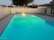 Inviting swimming pool with gray coping and lighting at 4220 W State Ave, Phoenix, AZ 85051