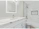 Bright bathroom with stand up shower, modern tiling, and a modern vanity at 4220 W State Ave, Phoenix, AZ 85051