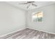 Bedroom featuring wood style floors, a bright window, and natural light at 4220 W State Ave, Phoenix, AZ 85051