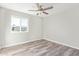 Bedroom featuring a ceiling fan and a bright window at 4220 W State Ave, Phoenix, AZ 85051