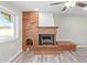 Living room featuring a brick fireplace with a decorative mantel and hearth at 4220 W State Ave, Phoenix, AZ 85051