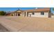 Single-story home featuring a covered carport and desert landscaping at 4220 W State Ave, Phoenix, AZ 85051