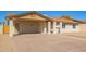 Single-story home featuring a covered carport and desert landscaping at 4220 W State Ave, Phoenix, AZ 85051