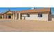 Single-story home featuring a covered carport and desert landscaping at 4220 W State Ave, Phoenix, AZ 85051