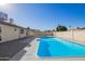 Exterior view of the pristine in-ground pool and backyard patio at 4220 W State Ave, Phoenix, AZ 85051