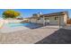 View of the in-ground pool and backyard patio at 4220 W State Ave, Phoenix, AZ 85051