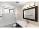 Clean bathroom with white tile, a bathtub, and updated vanity at 4947 E Adobe St, Mesa, AZ 85205