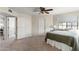 Well-lit bedroom with carpet flooring, ceiling fan and large window at 4947 E Adobe St, Mesa, AZ 85205