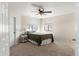 Cozy bedroom with carpet flooring, ceiling fan, and ample natural light at 4947 E Adobe St, Mesa, AZ 85205