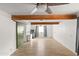 Bright living room featuring wood beams, tile floors, and a barn door at 4947 E Adobe St, Mesa, AZ 85205