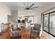 Bright and airy living area with hardwood floors and a view into the kitchen at 4947 E Adobe St, Mesa, AZ 85205