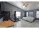 Spacious bedroom with large bed, exercise equipment, and ample natural light at 5175 W Warren Dr, Casa Grande, AZ 85194