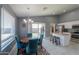 Kitchen and dining area with teal chairs and a wood table at 5175 W Warren Dr, Casa Grande, AZ 85194