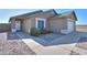 Single-story house with a two-car garage and landscaped front yard at 5175 W Warren Dr, Casa Grande, AZ 85194