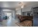 Spacious living room with a large sectional sofa and tile flooring at 5175 W Warren Dr, Casa Grande, AZ 85194