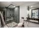 Modern bathroom with a large walk-in shower and dark vanity at 5712 E Calle Camelia --, Phoenix, AZ 85018