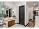 Modern bathroom with a walk-in closet and dual vanity at 5712 E Calle Camelia --, Phoenix, AZ 85018