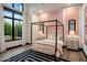 Charming bedroom with a four-poster bed and pink accents at 5712 E Calle Camelia --, Phoenix, AZ 85018