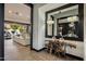 Elegant entryway with a large mirror and a unique wood console table at 5712 E Calle Camelia --, Phoenix, AZ 85018