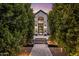 Inviting entryway, framed by lush greenery, leading to the front door at 5712 E Calle Camelia --, Phoenix, AZ 85018