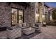 Relaxing patio area with wicker furniture, adjacent to the home at 5712 E Calle Camelia --, Phoenix, AZ 85018