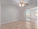 Spacious bedroom with tile floors and access to sunroom at 5804 E Dallas St, Mesa, AZ 85205