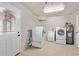 Convenient laundry room with washer, dryer, utility sink and exterior access at 5804 E Dallas St, Mesa, AZ 85205