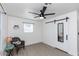 Bedroom with barn door, mirror, and ceiling fan at 621 W Howe St, Tempe, AZ 85281