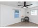 Bright bedroom with wood-look floors, ceiling fan, and window coverings at 621 W Howe St, Tempe, AZ 85281