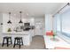 Modern white kitchen with breakfast nook and island at 621 W Howe St, Tempe, AZ 85281