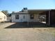 Backyard with covered patio and storage shed at 676 N 7Th Pl, Coolidge, AZ 85128