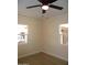 Well-lit bedroom with neutral walls, wood-look flooring, and ceiling fan at 676 N 7Th Pl, Coolidge, AZ 85128