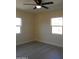 Bright bedroom with ceiling fan and wood-look flooring at 676 N 7Th Pl, Coolidge, AZ 85128