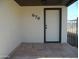 Front entrance with tiled flooring and a modern dark-framed door at 676 N 7Th Pl, Coolidge, AZ 85128