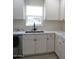 Modern kitchen features white shaker cabinets, quartz countertops and a stylish sink at 676 N 7Th Pl, Coolidge, AZ 85128