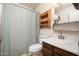 Clean bathroom with shower/tub combo and updated vanity at 6815 W Reade Ave, Glendale, AZ 85303