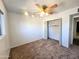 Bright bedroom features carpet, closet with shelves and natural light at 6815 W Reade Ave, Glendale, AZ 85303