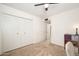 Bedroom with double doors leading to closet and hallway at 6815 W Reade Ave, Glendale, AZ 85303