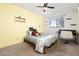 Charming bedroom with yellow walls and built-in shelving at 6815 W Reade Ave, Glendale, AZ 85303