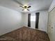 Comfortable bedroom with a window for natural light and a closet for storage solutions at 6815 W Reade Ave, Glendale, AZ 85303