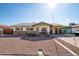 Brick ranch house with carport and landscaped front yard at 6815 W Reade Ave, Glendale, AZ 85303