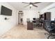 Spacious home office with hardwood floors and a view of the dining area at 6815 W Reade Ave, Glendale, AZ 85303