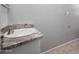 Bathroom with granite countertop, white sink, and modern faucet at 7004 N 11Th Way, Phoenix, AZ 85020